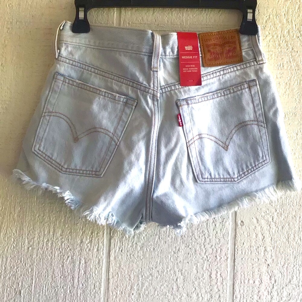 Levi’s wedgie fit high rise ripped cutoff shorts